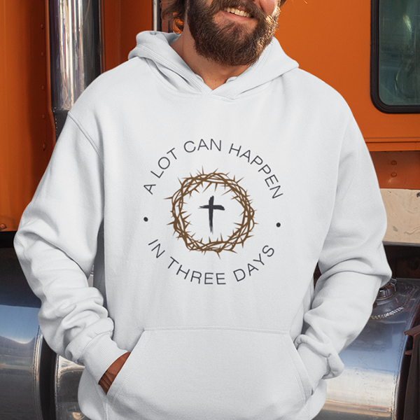 A Lot Can Happen In Three Days Premium Sober Apparel hoodie worn by a smiling man outdoors. made from preshrunk cotton for a soft and comfortable feel.